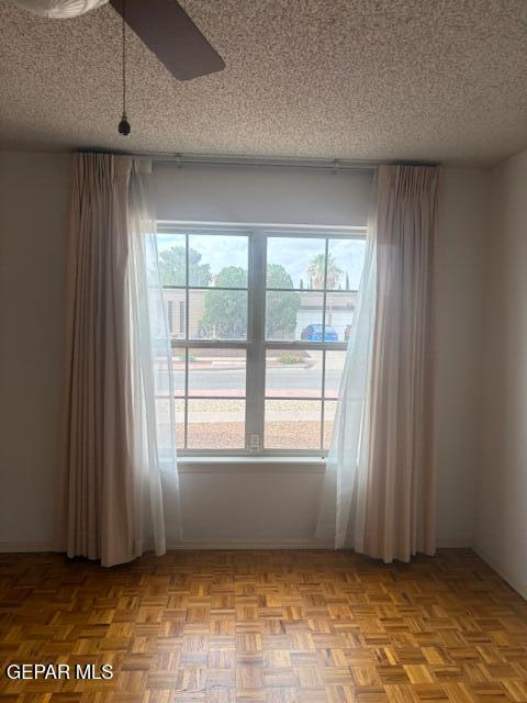 10700 Janway Dr, El Paso, TX 79935 - unfurnished room with a textured ceiling and a ceiling fan