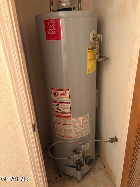10700 Janway Dr, El Paso, TX 79935 - utility room featuring water heater
