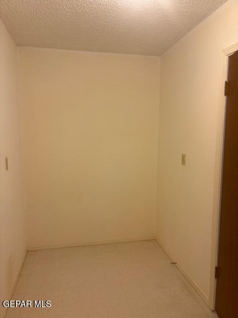 10700 Janway Dr, El Paso, TX 79935 - unfurnished room featuring a textured ceiling