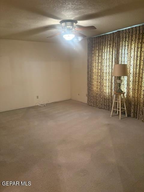 10700 Janway Dr, El Paso, TX 79935 - empty room featuring ceiling fan, a textured ceiling, and light colored carpet