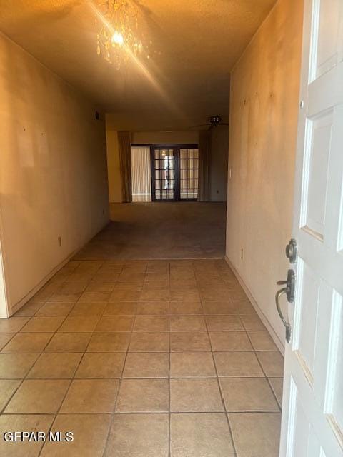 10700 Janway Dr, El Paso, TX 79935 - hallway featuring light tile patterned floors