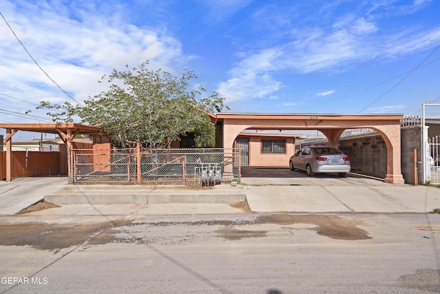 204 Ruth St, Anthony, NM 88021 - view of parking with driveway, a gate, and a carport