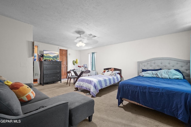 204 Ruth St, Anthony, NM 88021 - bedroom with carpet floors, a textured ceiling, and a ceiling fan