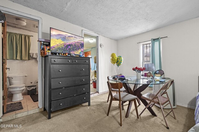 204 Ruth St, Anthony, NM 88021 - dining area featuring a textured ceiling and carpet floors