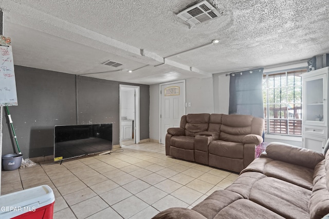 204 Ruth St, Anthony, NM 88021 - tiled living room featuring a textured ceiling