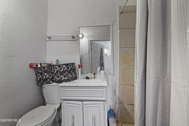 204 Ruth St, Anthony, NM 88021 - bathroom with a textured wall, vanity, and a shower with curtain