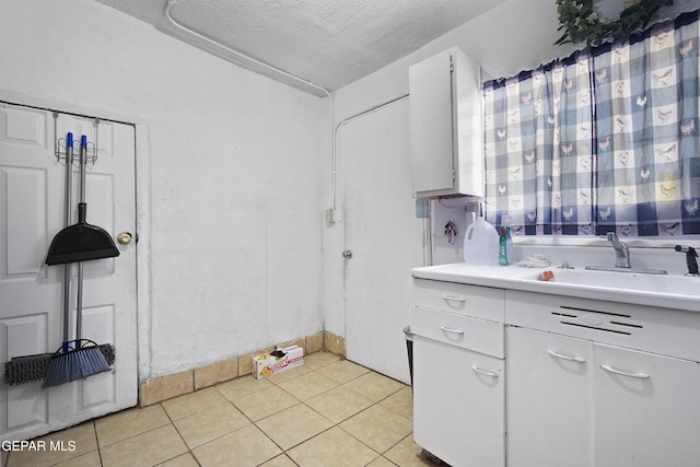 204 Ruth St, Anthony, NM 88021 - bathroom featuring tile patterned floors, vanity, and a textured ceiling