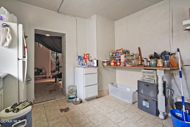 204 Ruth St, Anthony, NM 88021 - kitchen featuring freestanding refrigerator and tile patterned floors