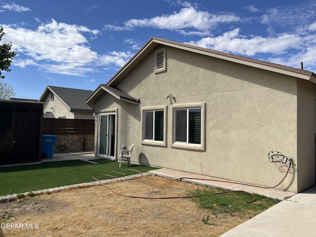 11128 Colbert Coldwell Ln, Socorro, TX 79927 - rear view of house featuring stucco siding, an outdoor structure, and a patio area