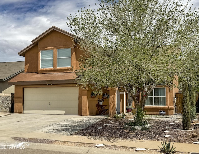 14177 Spanish Point Dr, El Paso, TX 79938 - view of front of home with a garage, driveway, and stucco siding