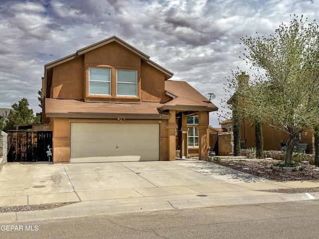 14177 Spanish Point Dr, El Paso, TX 79938 - view of front of property with a garage, stucco siding, and concrete driveway
