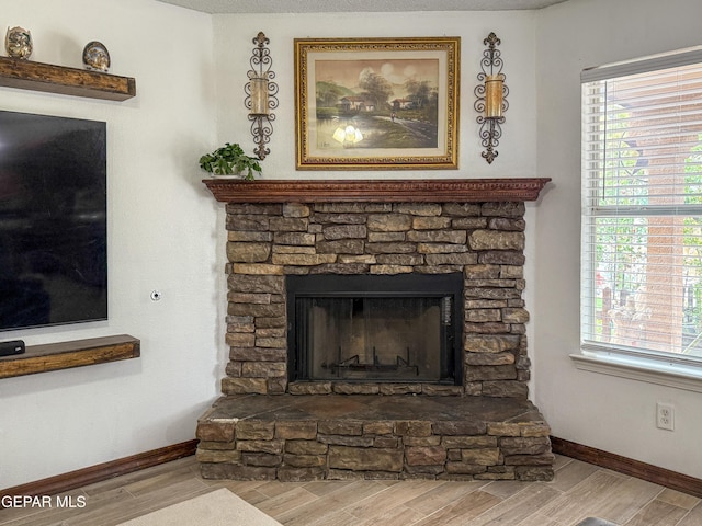 14177 Spanish Point Dr, El Paso, TX 79938 - detailed view of wood finished floors and a stone fireplace
