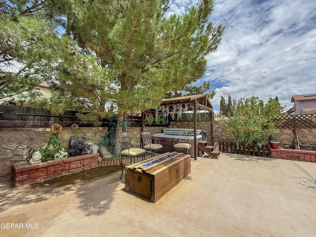 14177 Spanish Point Dr, El Paso, TX 79938 - fenced backyard with a hot tub and a patio area