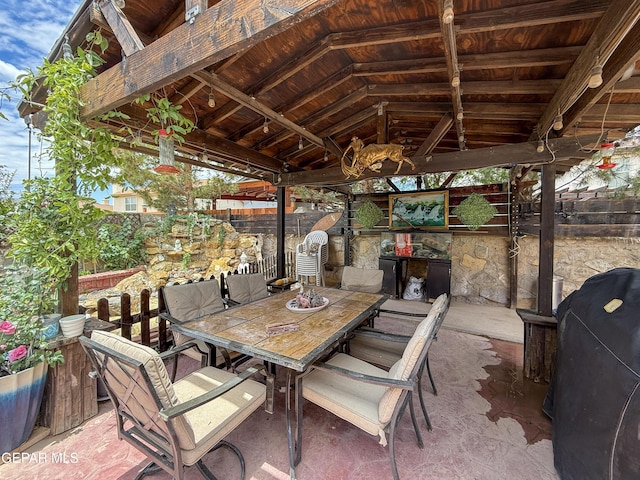 14177 Spanish Point Dr, El Paso, TX 79938 - fenced backyard with a patio, outdoor dining area, and exterior kitchen