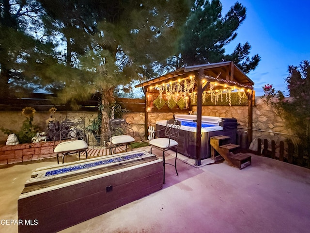 14177 Spanish Point Dr, El Paso, TX 79938 - fenced backyard featuring a hot tub, a fire pit, and a patio