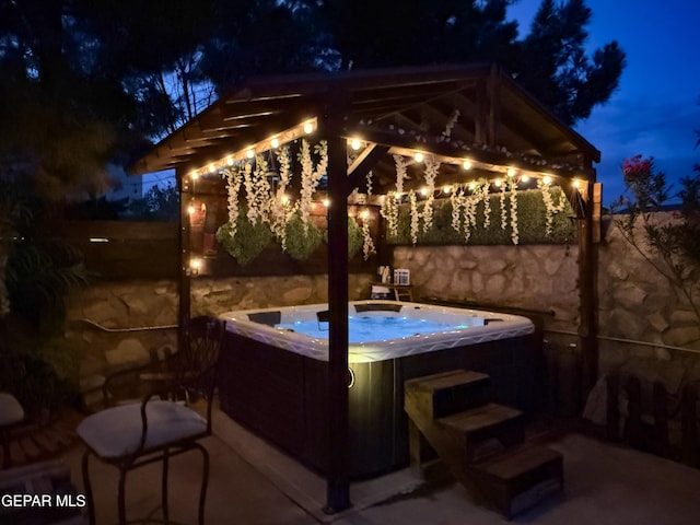 14177 Spanish Point Dr, El Paso, TX 79938 - patio at twilight with a hot tub and a gazebo