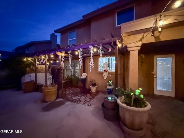 14177 Spanish Point Dr, El Paso, TX 79938 - patio at twilight featuring a patio area and a pergola