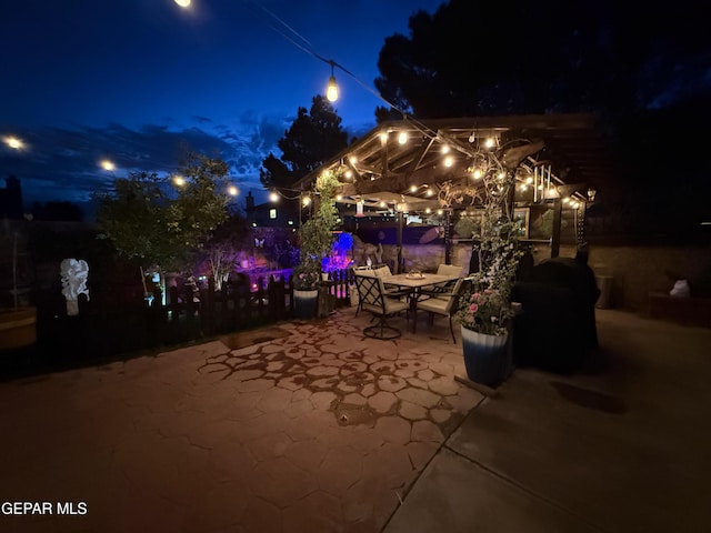 14177 Spanish Point Dr, El Paso, TX 79938 - patio at night with a patio area and outdoor dining space