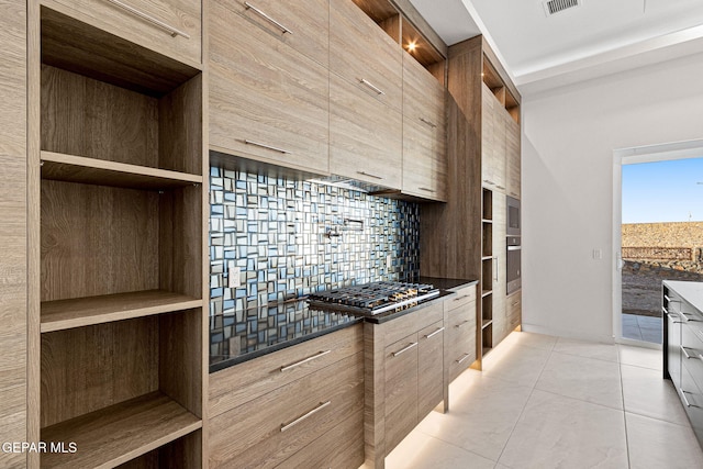 7349 Cimarron Rim Dr, El Paso, TX 79911 - kitchen featuring modern cabinets, stainless steel appliances, open shelves, light tile patterned flooring, and dark countertops