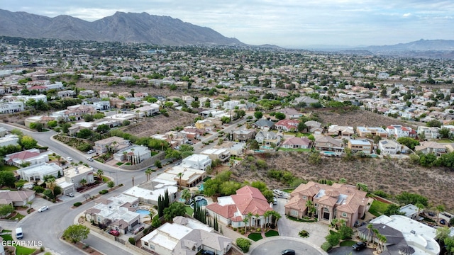 6528 Calle Placido Dr, El Paso, TX 79912 - aerial view of property's location with a mountain backdrop and nearby suburban area