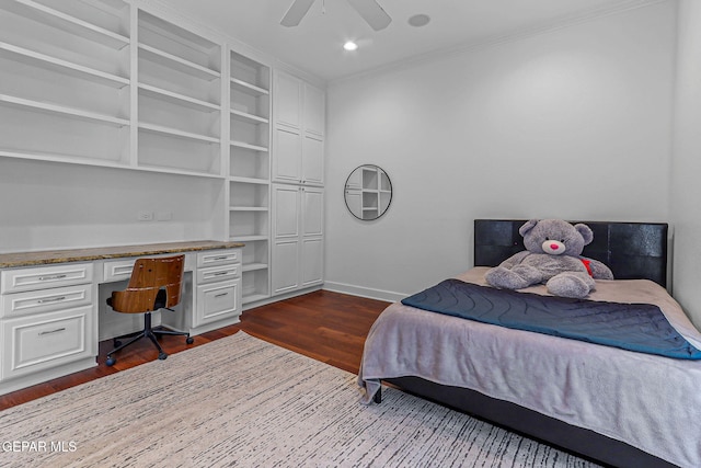6528 Calle Placido Dr, El Paso, TX 79912 - bedroom with built in study area, dark wood-style flooring, ornamental molding, ceiling fan, and recessed lighting