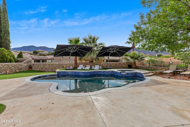 6528 Calle Placido Dr, El Paso, TX 79912 - view of pool with an in-ground hot tub, a patio area, a fenced backyard, and a mountain view