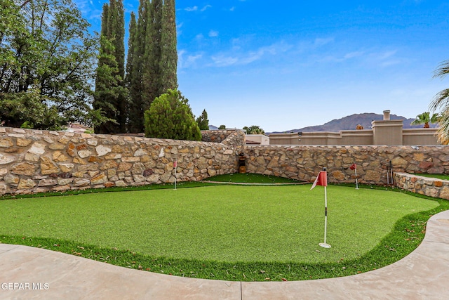 6528 Calle Placido Dr, El Paso, TX 79912 - view of yard with a putting area and a mountain view
