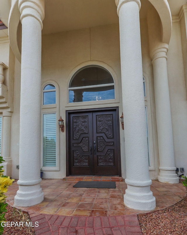 6528 Calle Placido Dr, El Paso, TX 79912 - property entrance with stucco siding and french doors