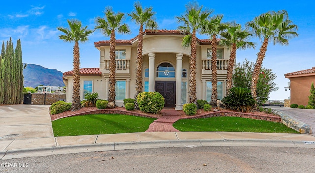 6528 Calle Placido Dr, El Paso, TX 79912 - view of front of house featuring stucco siding, a tiled roof, and a mountain view