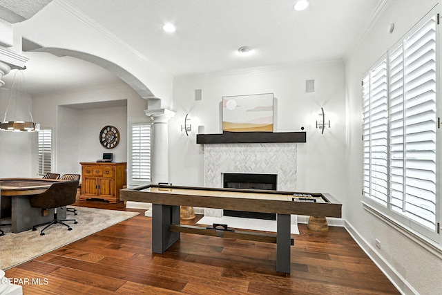 6528 Calle Placido Dr, El Paso, TX 79912 - game room featuring wood finished floors, crown molding, healthy amount of natural light, a tile fireplace, and recessed lighting