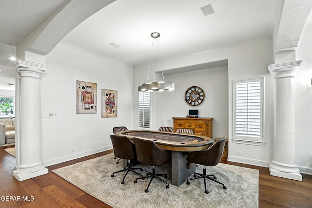 6528 Calle Placido Dr, El Paso, TX 79912 - dining space featuring ornate columns and dark wood finished floors