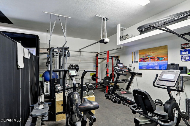 6528 Calle Placido Dr, El Paso, TX 79912 - workout area with a textured ceiling