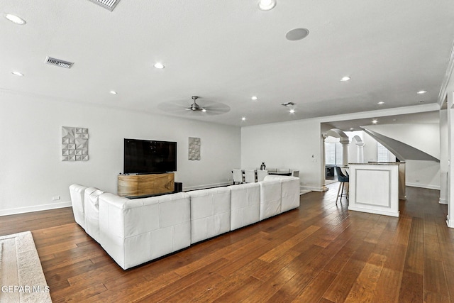 6528 Calle Placido Dr, El Paso, TX 79912 - living room with ceiling fan, arched walkways, recessed lighting, dark wood-type flooring, and ornate columns