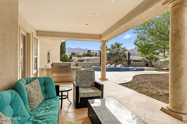 6528 Calle Placido Dr, El Paso, TX 79912 - view of patio / terrace with grilling area, a mountain view, and an outdoor living space