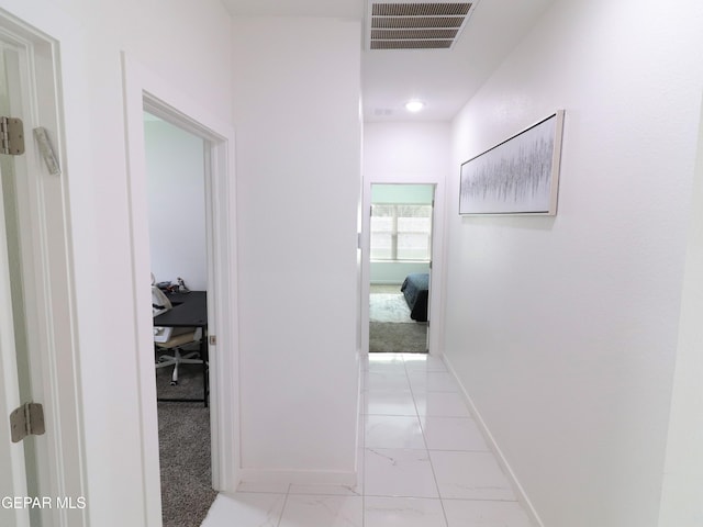 480 Deserts Dr, Socorro, TX 79927 - corridor with a desk and light marble finish floors