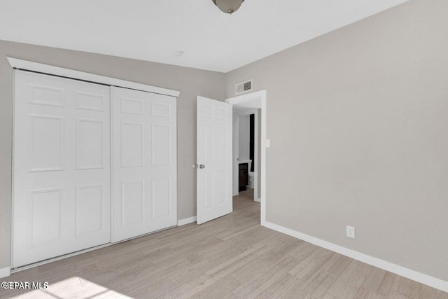 11860 Jim Ferriell Dr, El Paso, TX 79936 - unfurnished bedroom with light wood finished floors and a closet
