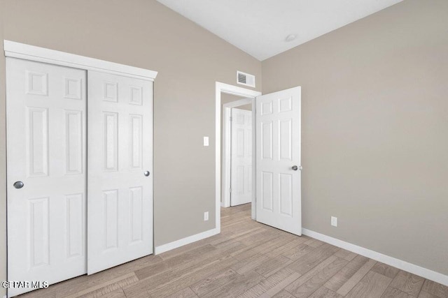 11860 Jim Ferriell Dr, El Paso, TX 79936 - unfurnished bedroom with light wood-type flooring and a closet