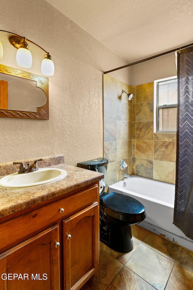 11852 Pete Rose Dr, El Paso, TX 79936 - bathroom featuring a textured wall, vanity, shower / bath combination with curtain, and a textured ceiling