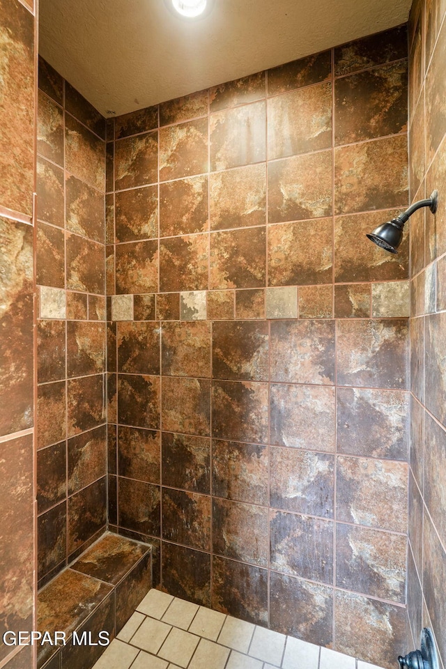 11852 Pete Rose Dr, El Paso, TX 79936 - full bath with a tile shower and tile patterned floors