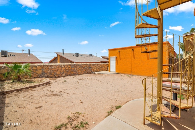 11852 Pete Rose Dr, El Paso, TX 79936 - fenced backyard with a patio area