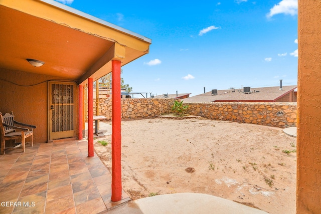 11852 Pete Rose Dr, El Paso, TX 79936 - fenced backyard with a patio