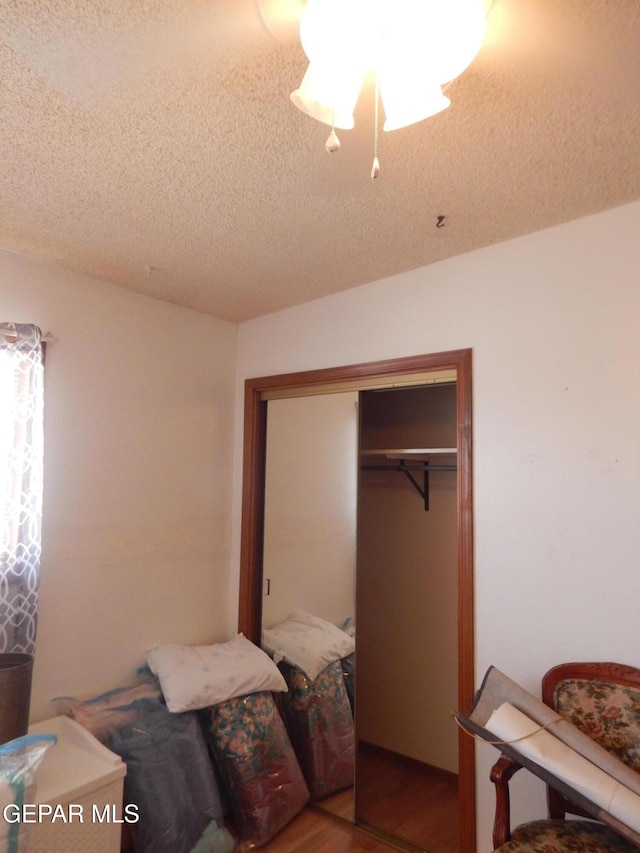 5325 Fairbanks Dr, El Paso, TX 79924 - bedroom featuring a textured ceiling, a closet, and wood finished floors