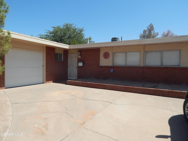 5325 Fairbanks Dr, El Paso, TX 79924 - ranch-style home featuring a garage, concrete driveway, and brick siding