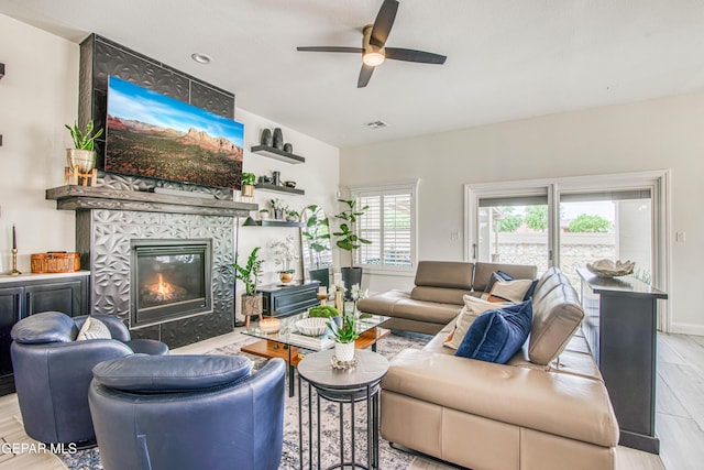 5705 Valley Lilac Ln, El Paso, TX 79932 - living room featuring a ceiling fan, light wood-style floors, and a fireplace