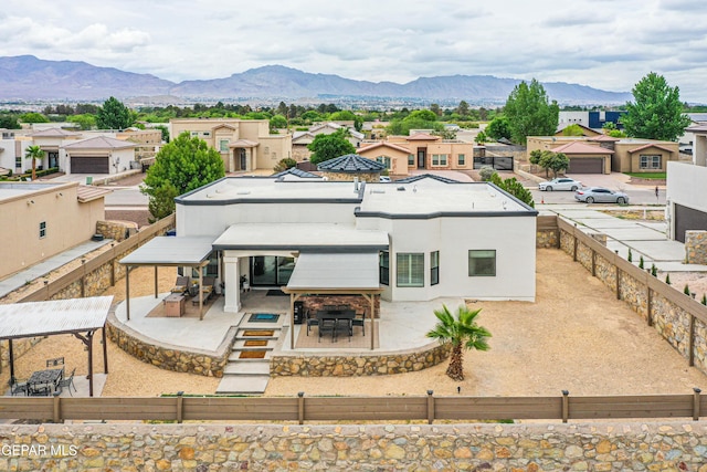5705 Valley Lilac Ln, El Paso, TX 79932 - rear view of property featuring a fenced backyard, a mountain view, a residential view, and a patio