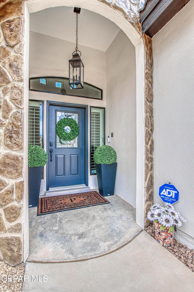 5705 Valley Lilac Ln, El Paso, TX 79932 - view of exterior entry with stone siding and stucco siding