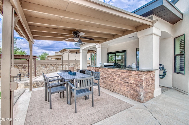 5705 Valley Lilac Ln, El Paso, TX 79932 - view of patio featuring an outdoor kitchen, a ceiling fan, and outdoor dining space