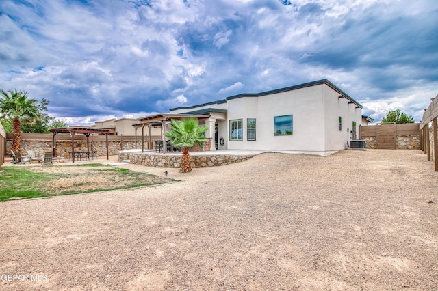 5705 Valley Lilac Ln, El Paso, TX 79932 - back of house featuring a pergola, a patio, a fenced backyard, and stucco siding