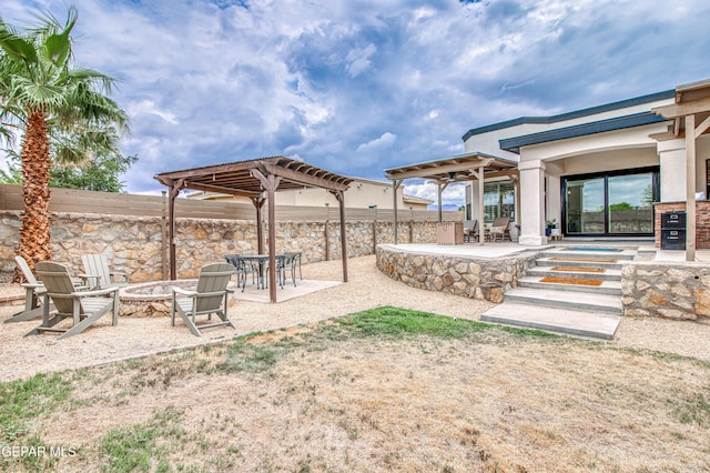 5705 Valley Lilac Ln, El Paso, TX 79932 - view of yard with a fire pit, a patio, and a pergola