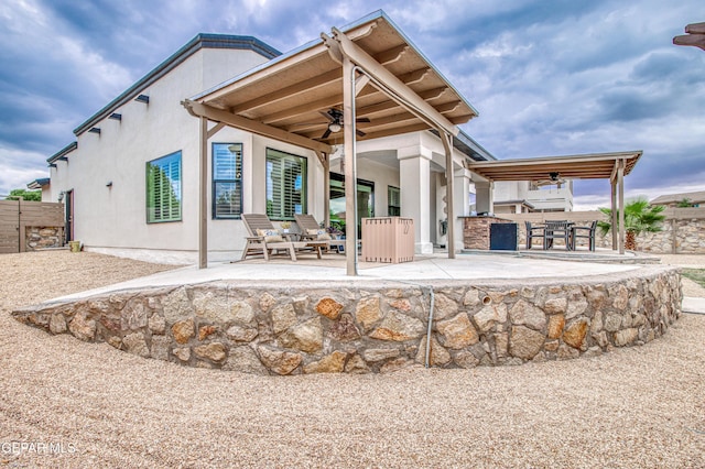 5705 Valley Lilac Ln, El Paso, TX 79932 - back of house with a ceiling fan, a patio area, and stucco siding